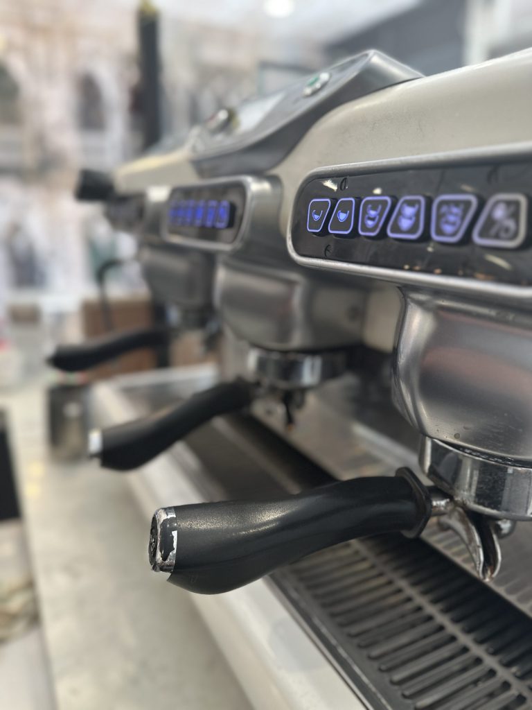 Professional espresso machine used for authentic Italian coffee