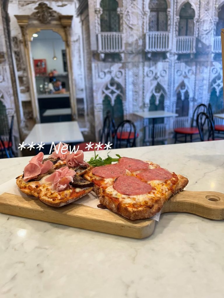 Italian ciabatta pizzaiola sandwiches with prosciutto and salami